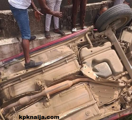 Abuja Car Accident: Peugeot 206 Plunges into Zone 7 Bridge Stream